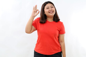Smiling asian woman showing okay, Very good with satisfied face expression, praise and compliment...