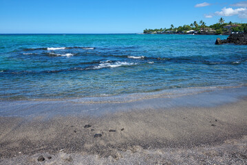 Stunning Volcanic Black Sand Beach in Hawaii with Turquoise Ocean Waves and Clear Blue Sky - Tropical Island Paradise Seascape for Travel and Vacation