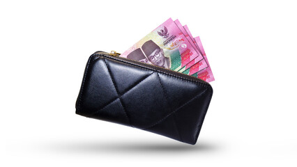 Indonesian rupiah  money currency notes inside a black purse isolated on a transparent background
