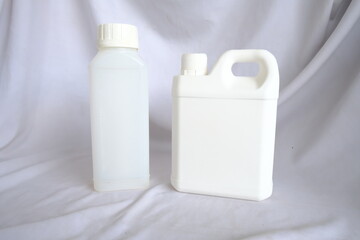 Two White Plastic Bottles for Packaging and Mockup Purposes on Clean Background