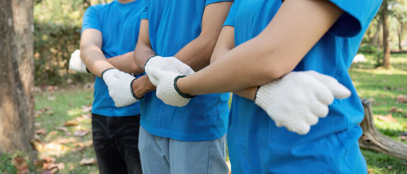 Unity in Action and Environmental Volunteerism. Volunteers pose confidently, showcasing their commitment to sustainability.