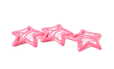 Many pink star shaped hair clips isolated on white