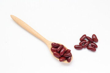 Red beans in spoon on white background 