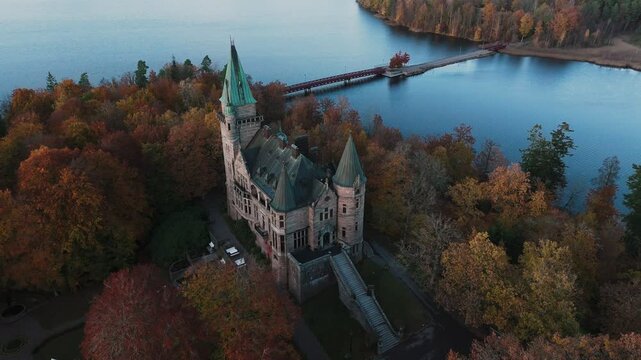 Tracking shot towards Teleborg Castle in V&auml;xjo, Sweden, Fall, Orange and Yellow Leafs