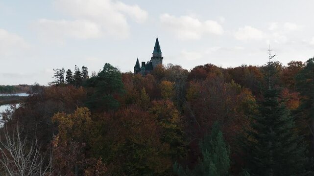 Tracking shot towards Teleborg Castle in V&auml;xjo, Sweden, Fall, Orange and Yellow Leafs