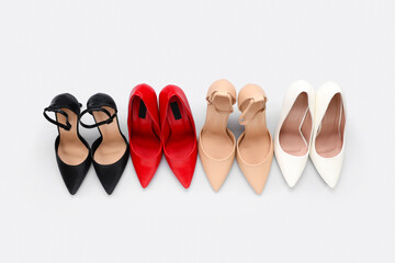 High-heeled female shoes on white background. Top view