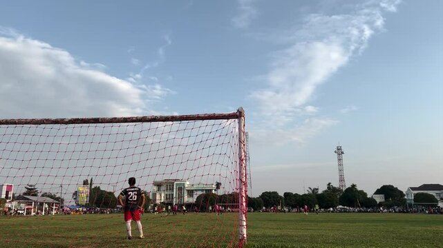 Amateur football match between villages in Indonesia