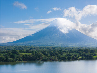 Fototapeta premium Concepcion volcano with white cloud on peak
