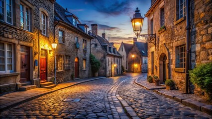 Obraz premium Worn cobblestone street in historic town center at dusk, with old stone buildings and lanterns lit , street lighting, evening atmosphere
