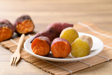 Orange and yellow sweet potato on plate ready to eating, Healthy food