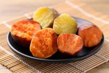 Orange and yellow sweet potato on plate ready to eating, Healthy food