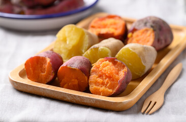 Orange and yellow sweet potato on plate ready to eating, Healthy food