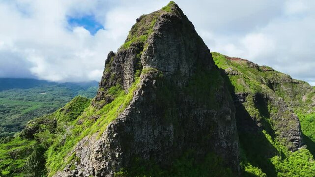 Aerial view flying close to the Kalalea King Kong mountain, in sunny Kauai, Hawaii