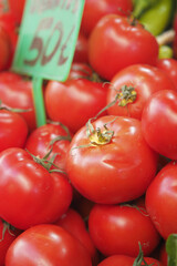 Fresh red tomatoes for sale at a local market in the afternoon