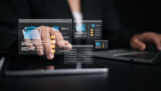 Document Management System (DMS) being setup by IT consultant working on laptop computer in office, Businesswoman using computer to document management, Workflow sharing, Backup online document files