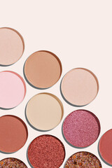 Cosmetics texture pattern, Warm vivid colored eye shadow makeup palette, round eye powder swatches. Female cosmetic and beauty products, aesthetic minimal beauty photo, colorful eyeshade, top view