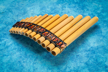 bamboo pan flute instrument from Peru against textured art paper © MarekPhotoDesign.com