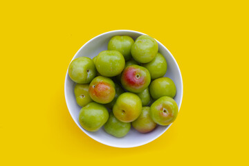 Fresh green plum on white background