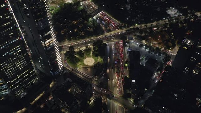 Highway Traffic Intersection at Night, Skyscraper Business Modern Buildings, Mexico City, City Lights &ndash; Aerial View, Dolly In