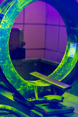 Inspector Performing a System Performance Test Using Magnetic Particle Testing Equipment Under UV...