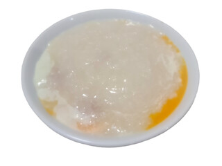 Chinese style minced pork porridge with Soft-boiled eggs on top for breakfast isolated on white background