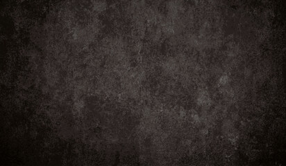 Black charcoal textured background - dark rough grunge surface with uneven smudged edge. Grainy stone wall backdrop for dramatic moody design. Abstract smoky coal concrete texture with vignette effect