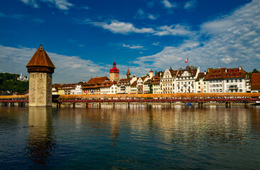 Lucern city with famous Chapel Bridge. Riverfront in Lucerne, Swiss. Lucerne city view. Canton of Lucerne. Lucern Switzerland. Sunrise in historic city center of Lucerne with lake.