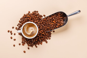 A steaming cup of freshly brewed coffee surrounded by rich, aromatic roasted coffee beans