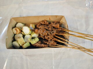rice cake and chicken satay