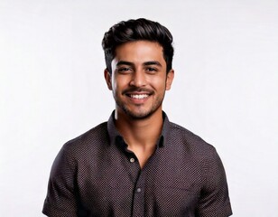 Obraz premium Smiling Young Indian Man Isolated on White Background: Confident & Happy Portrait of a Cheerful Young Indian Man Against a White Background Positive and Confident: Young Indian Man Smiling