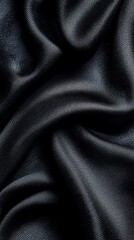 Fototapeta premium Close-up of Flowing Dark Fabric with Silky Texture and Smooth Ripples