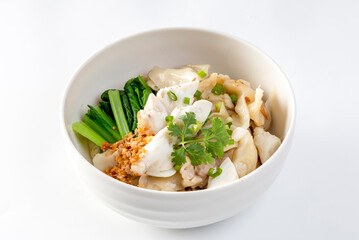 chinese egg noodle in bowl with slice red roasted pork, pork's wontons and white crab meat on it.