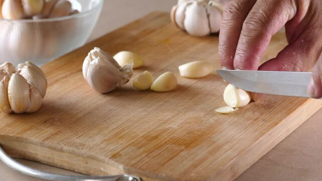 Slow motion of cutting fresh garlic
