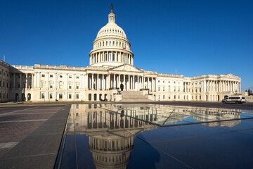 The United States Capitol as a symbol of democracy in Washington, DC. The Capitol building on Capitol Hill. US government. American flag adorns the dome of the historic Capitol. The Senate.