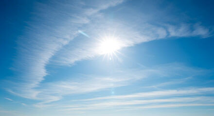 Sun Shining Brightly in a Clear Blue Sky with White Clouds