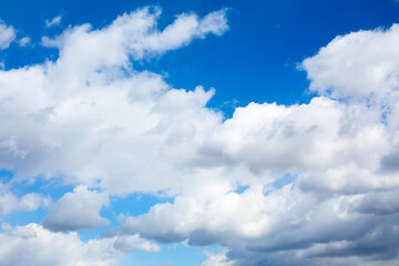 Blue sky with white and gray clouds background