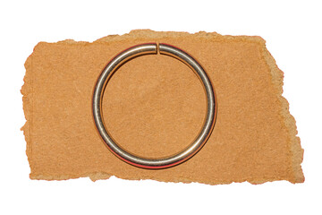 Stainless Steel Ring on Torn Brown Paper Surface Isolated on Transparent Background