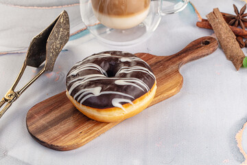 Delicous sweet donut with chocolate glaze