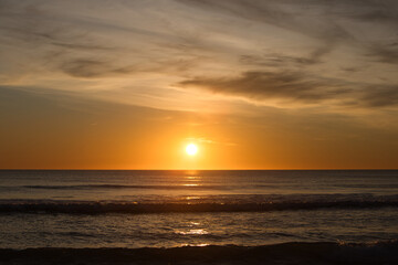 The sun reflecting on the sea in the golden hour in the atlantic ocean in Cadiz, Spain. Reflection...