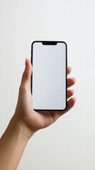 Hand of adult holding modern smartphone with blank screen