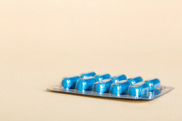 Blister package with Vitamin on color background. Medicine pills on a light background. Medicines...