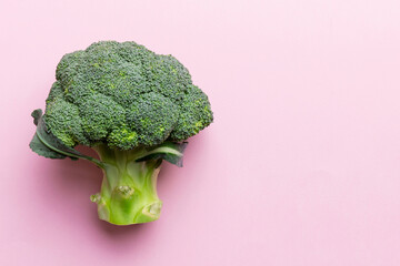 Top view fresh green broccoli vegetable on Colored background. Broccoli cabbage head Healthy or...