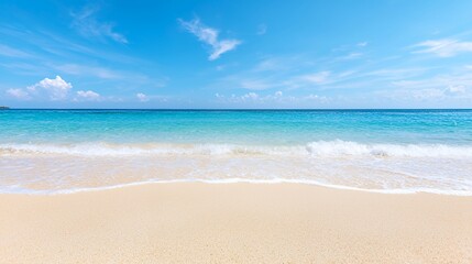 Fototapeta premium Sandy Beach with Gentle Waves and Bright Blue Sky Scenery