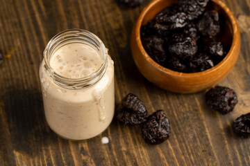 fresh cow's milk yogurt with prune flavor with dried plum slices
