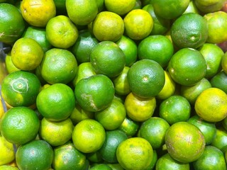Jeruk Kasturi (Kalamansi) for fresh Indonesian orange juice – a zesty and refreshing choice, perfect for Iftar during Ramadan. Alam Sutera, Indonesia - March 15, 2025