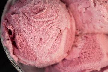 delicious sweet cold raspberry  flavored ice cream and ripe raspberries in a glass