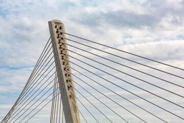  Modern cable-stayed bridge against cloudy sky, showcasing engineering marvel and urban architecture beauty
