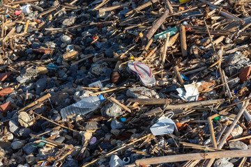  Shoreline pollution with plastic waste and debris highlights environmental challenges and the need for cleanup efforts