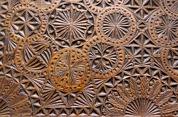 Old ornamental wooden sculpture with floral and geometric motifs