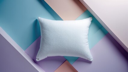 Going to sleep, drifting off. Overhead view of a white pillow set against a pastel background.